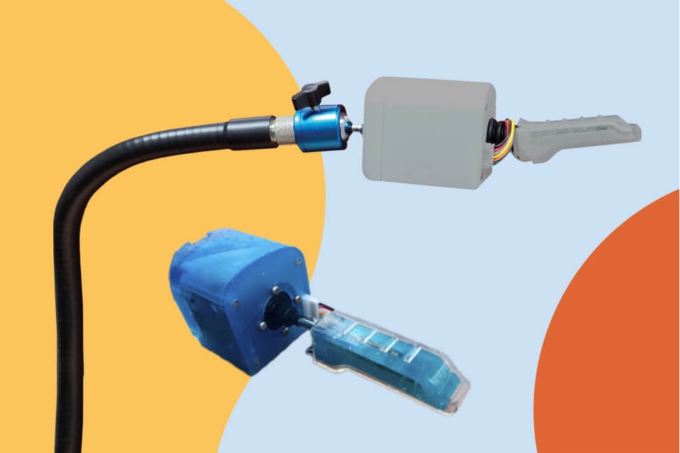 Puffin input device in blue and grey plastic casing with and without arm link